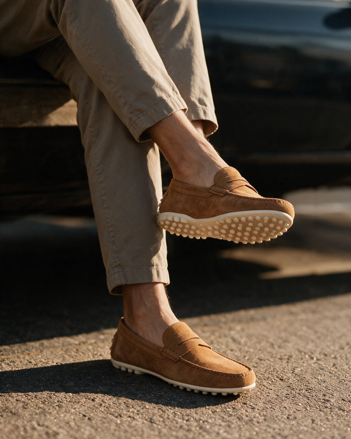 Lorvano Driver Loafers in cognac suede worn, showing the cream rubber pebble driving sole