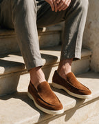 Lorvano Premium Suede Loafers in cognac suede worn on sunlit stone steps